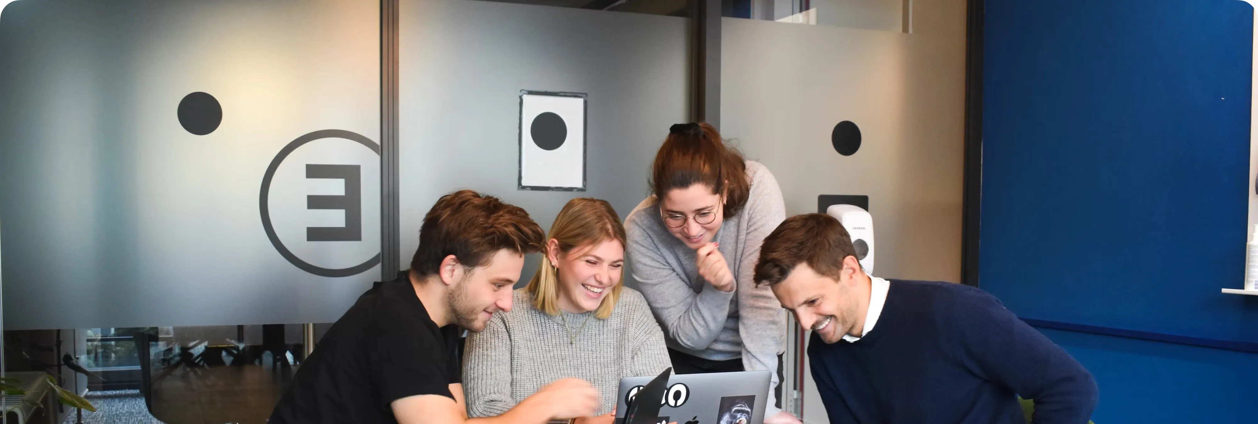 Colleagues reviewing figures together in an office