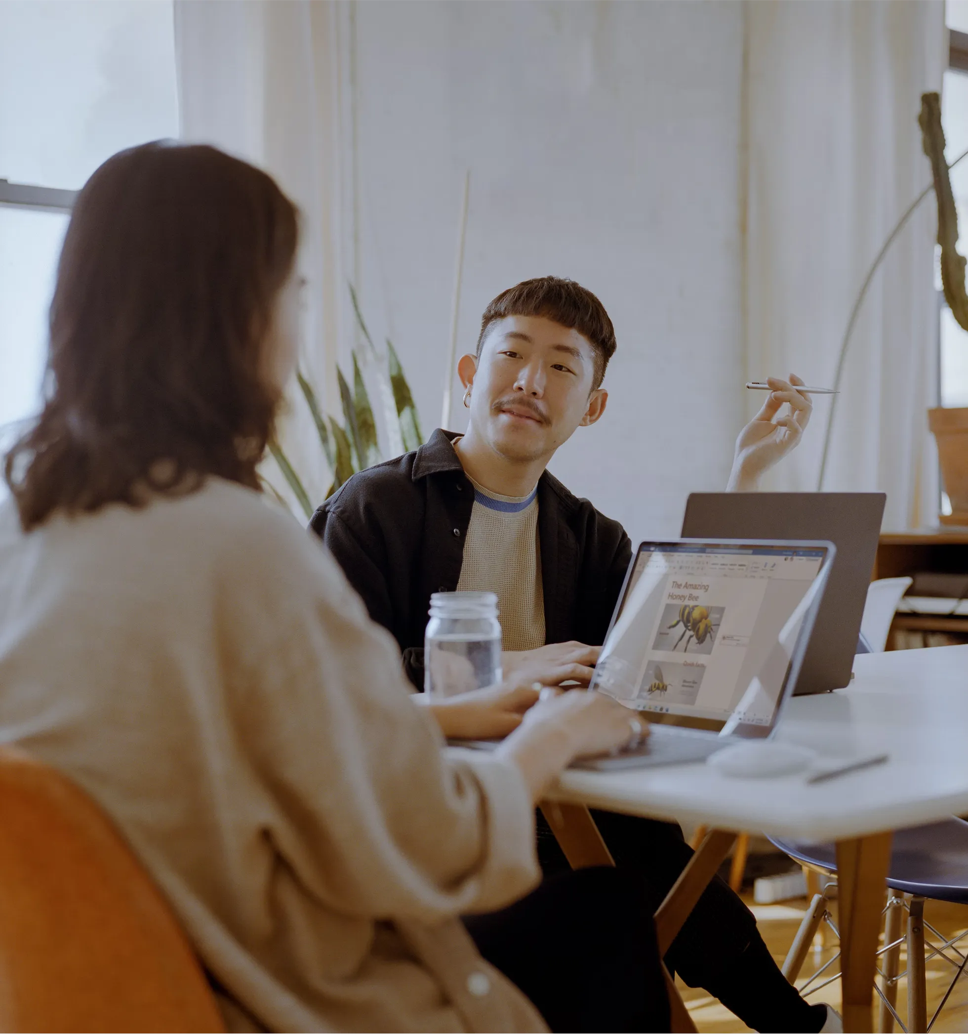 A finance team working through numbers around a table